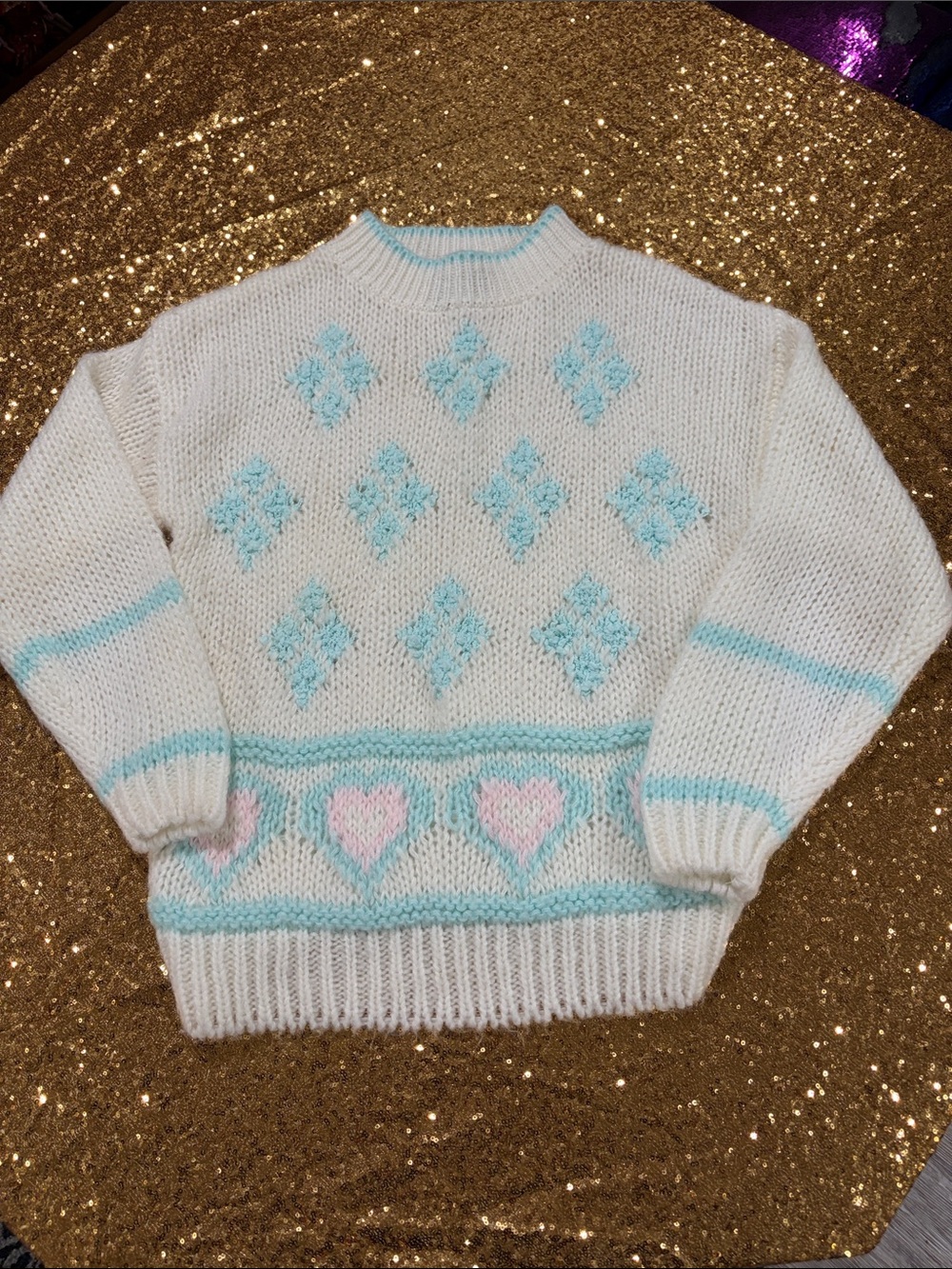 Cozy White Crewneck Sweater with Pastel Blue & Pink Heart Detail